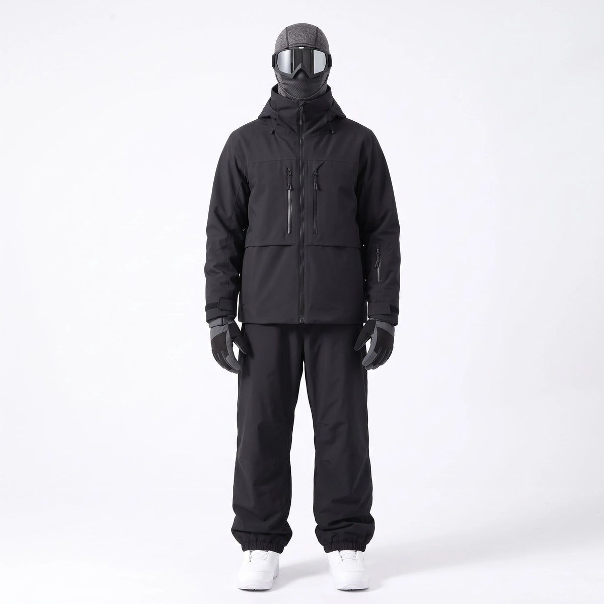Pack Val d'Isère – combinaison de ski noire portée avec gants, masque et cagoule