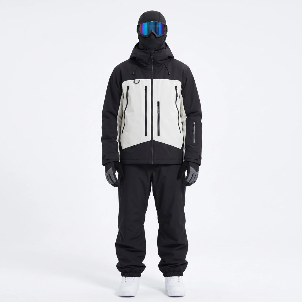 Pack Val Thorens – combinaison de ski noir et blanc portée avec gants, masque et cagoule