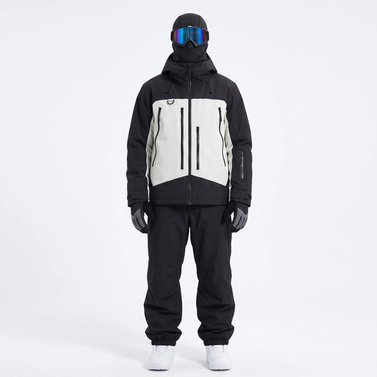 Pack Val Thorens – combinaison de ski noir et blanc portée avec gants, masque et cagoule